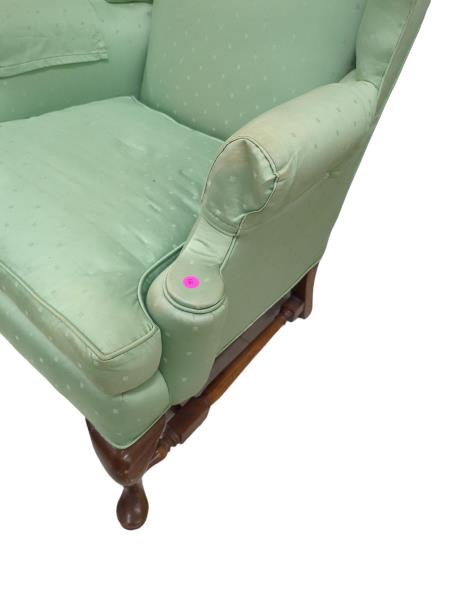 Green Wingback Chair with Wooden Legs and Pink Sticker - Cozy Club Chair with Unique Design