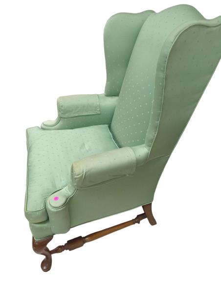 Green Wingback Chair with Wooden Legs and Pink Sticker - Cozy Club Chair with Unique Design